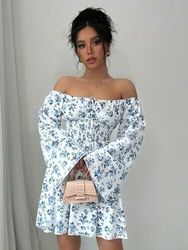 Woman in floral off-shoulder dress holding a small purse.